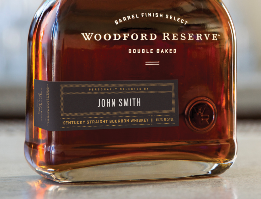 A bottle of Woodford Reserve Double Oaked selected by John Smith.